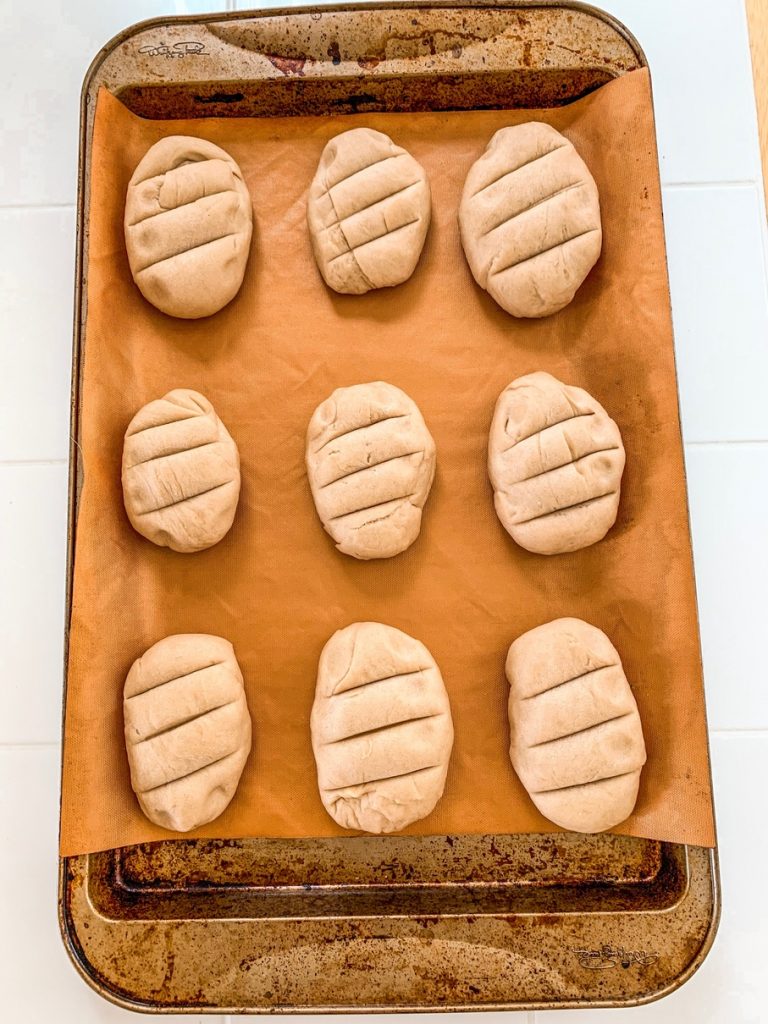 Breakfast rolls ready to bake on a baking tray