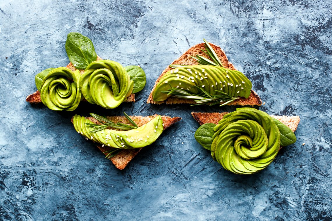 Avocado toasts on the marble desk