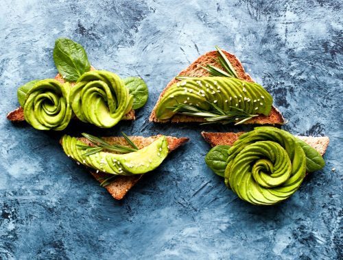 Avocado toasts on the marble desk